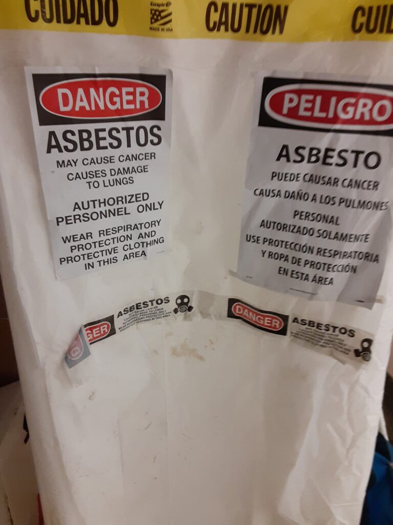 asbestos sign in English and Spanish