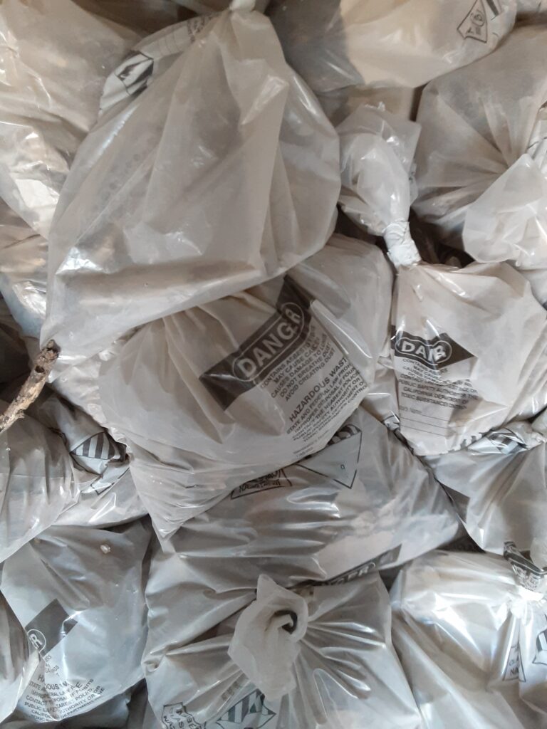 asbestos waste bagged and tagged